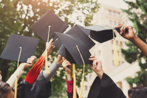 a group of people holding graduation caps